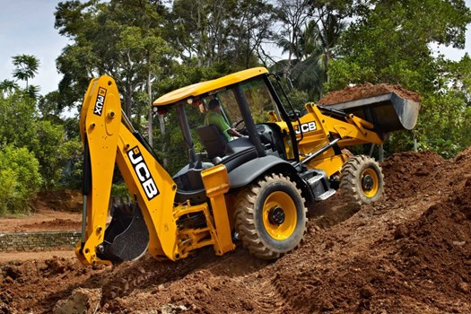 JCB backhoe loader working on a construction slope