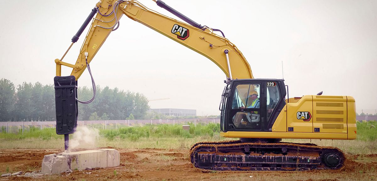 CAT excavator fitted with a hydraulic rock breaker