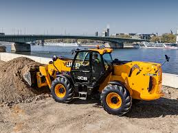JCB telescopic handler moving material on site